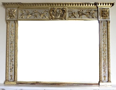 Lot 1013 - A parcel gilt overmantel with applied central...