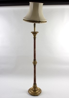 Lot 1017 - A gilded and material covered lamp, 189cm...