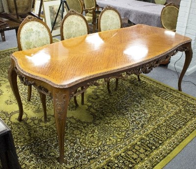 Lot 1030 - A French modern walnut dining table and six...