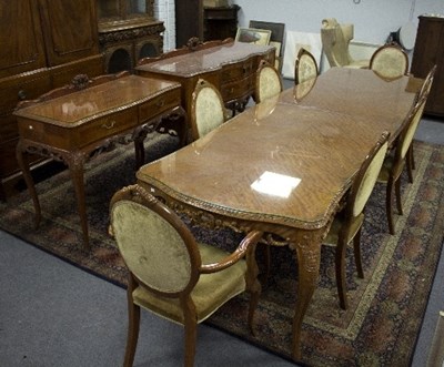 Lot 1031 - A French modern walnut dining suite comprising...