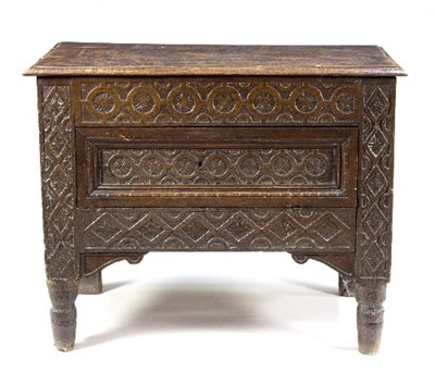 Lot 1038 - A Spanish carved oak chest with hinged panel...