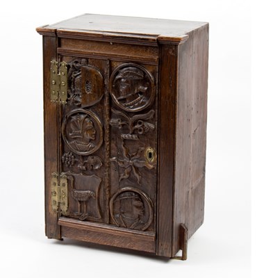 Lot 1044 - A small oak cupboard, the 16th Century door...