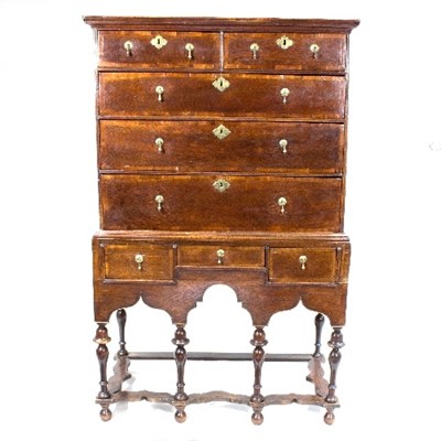 Lot 1055 - An early 18th Century oak chest on stand, the...