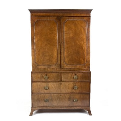 Lot 1067 - An early 19th Century mahogany linen press,...