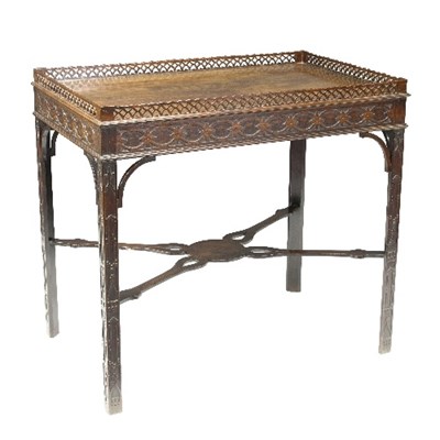 Lot 1099 - A George II style mahogany silver table, with...