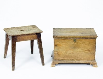 Lot 1107 - A small pine chest with hinged lid on ogee...