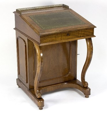 Lot 1122 - An 19th Century walnut davenport with pierced...