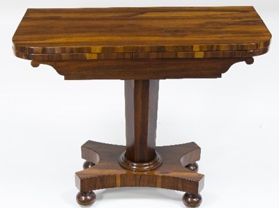 Lot 1129 - A Victorian rosewood foldover card table on...