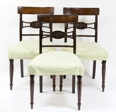 Lot 1142 - Three late George III mahogany chairs with...