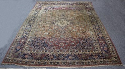 Lot 1192 - A large Kashan carpet, with abrashed field,...