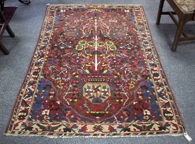 Lot 1197 - A Bakhtiari rug, with central vase containing...