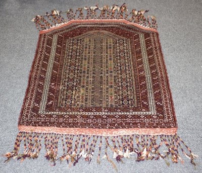 Lot 1210 - A modern Turkmen prayer rug, mid 20th century,...