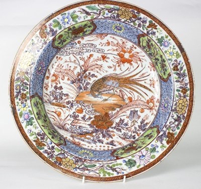 Lot 22 - An 18th Century clobbered Chinese circular...