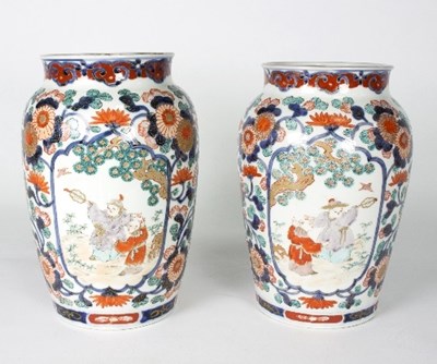 Lot 25 - A pair of Japanese Imari vases, decorated...