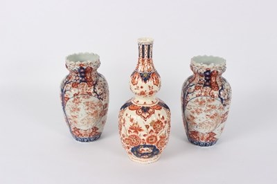 Lot 47 - A pair of Japanese Imari vases decorated...