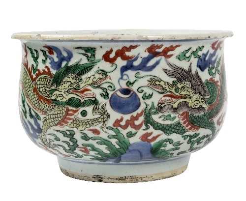 Lot 66 - A Chinese wucai bowl, decorated dragons and...