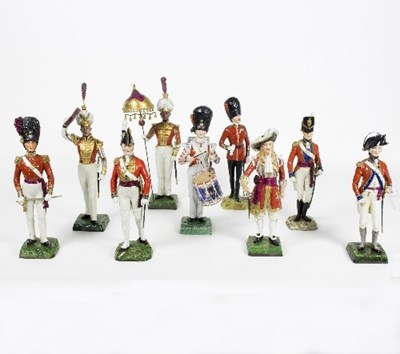 Lot 131 - Nine German porcelain figures of guardsmen,...