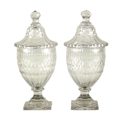 Lot 159 - A pair of Irish glass lidded jars, cut with...