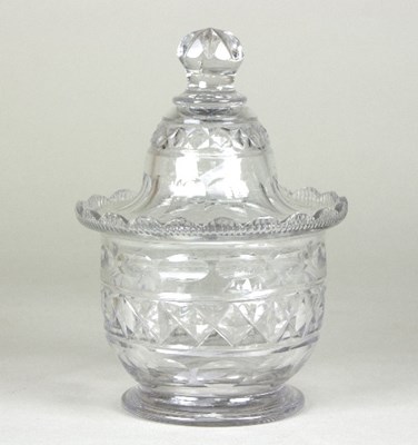 Lot 160 - A small Irish glass lidded jar, cut with ovals...