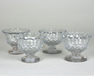 Lot 168 - A set of four Irish glass salts with petal...