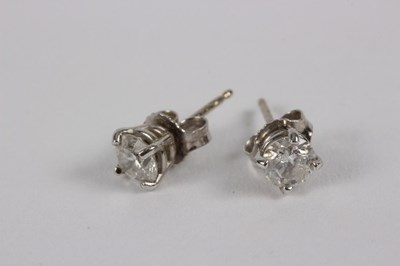 Lot 183 - A pair of diamond stud earrings, each...