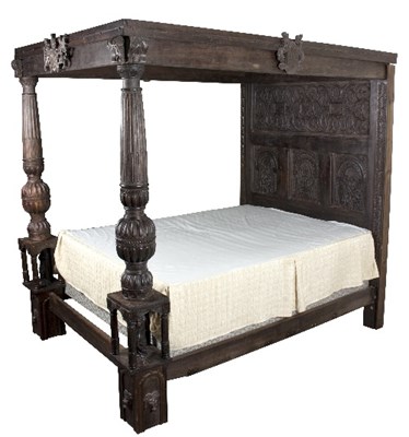 Lot 302 - A four-poster bed in the Tudor style, the...