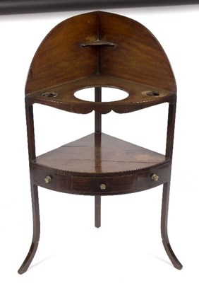 Lot 303 - A mahogany corner washstand fitted a single...