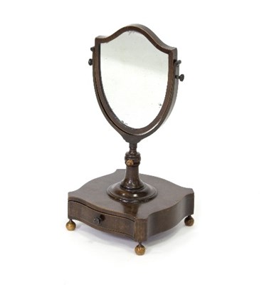 Lot 334 - A 19th Century shield shaped mirror on stand,...