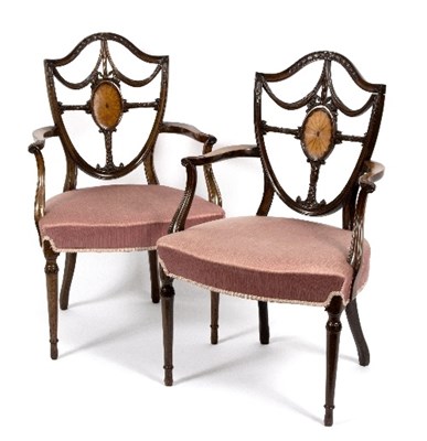 Lot 337 - A pair of mahogany shield back armchairs, the...