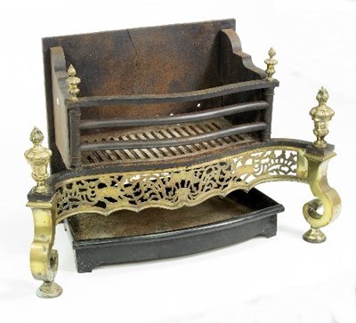 Lot 339 - A cast iron fire grate of Adam style, with...