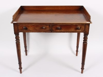 Lot 357 - A George IV mahogany washstand with solid...