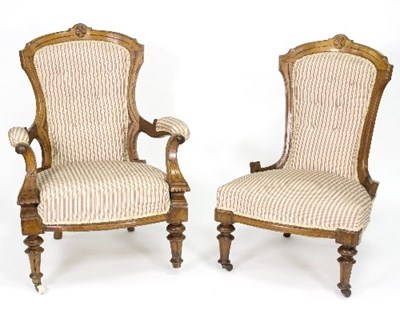 Lot 372 - A late Victorian pair of fireside chairs, on...