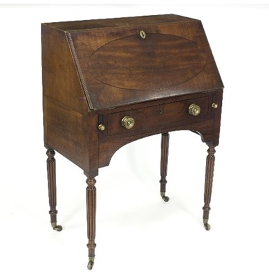 Lot 373 - A Regency mahogany bureau on reeded legs with...