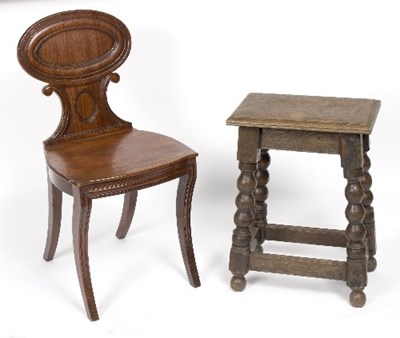 Lot 383 - An oak stool with bobbin turned legs and...