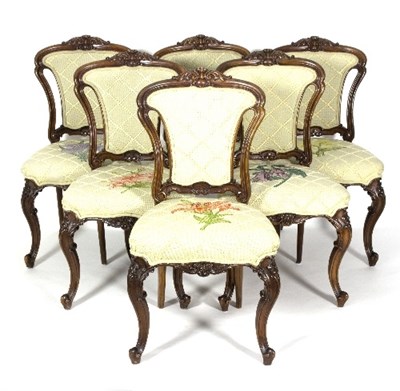 Lot 386 - A set of six carved walnut framed salon chairs,...