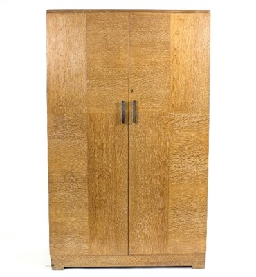 Lot 391 - A Heals oak compactum wardrobe, the interior...