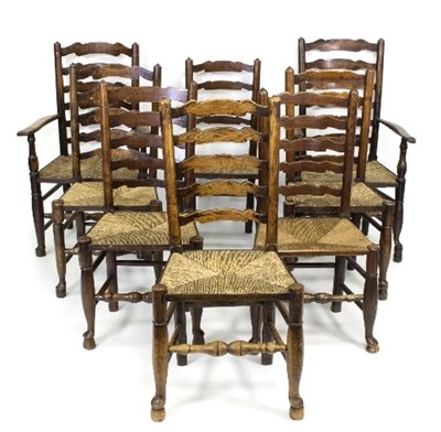 Lot 393 - A closely matched set of eight ash wood wavy...