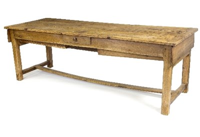 Lot 394 - A pine and elm farmhouse table, the planked...