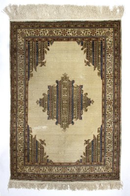 Lot 426 - A silk rug, with central medallion to an ivory...