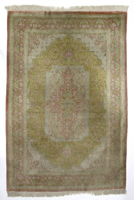 Lot 427 - A silk rug, with central rose medallion to a...