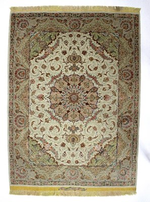 Lot 428 - A pair of Isfahan silk rugs, each with central...