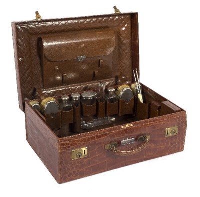 Lot 460 - A crocodile skin fitted dressing case...