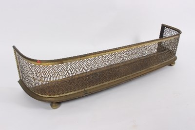 Lot 462 - A Georgian D-shaped brass fender, 115cm wide