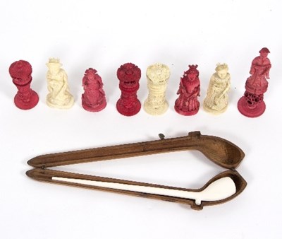 Lot 474 - Eight carved and stained red ivory chess...