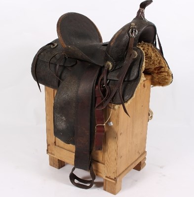 Lot 505 - Lot Withdrawn - A Western saddle with tooled...