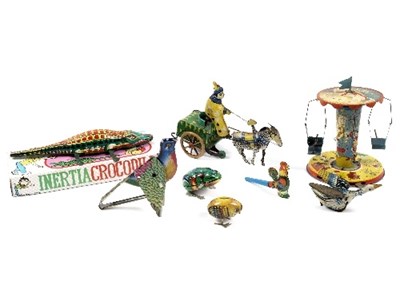 Lot 511 - A group of tinplate toys to include a...