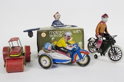 Lot 513 - A tinplate clockwork motorcycle and side car...