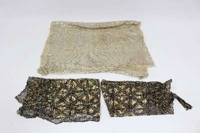 Lot 535 - An Assuit shawl, worked with silver coloured...