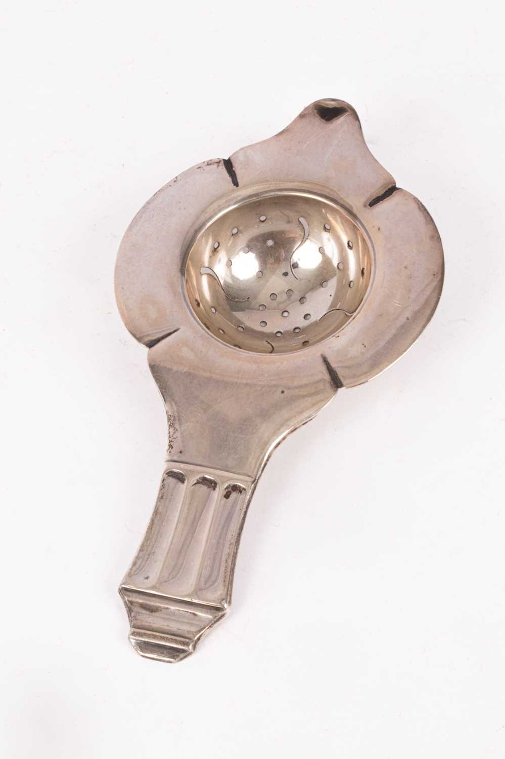 Lot 65 - A Danish silver tea strainer