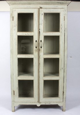Lot 11 - A glazed and painted bookcase, the two doors...